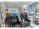 This basement features two leather recliners with a TV area and adjacent bed for versatile leisure and living at 5016 N 68Th Dr, Glendale, AZ 85303