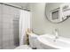 Bathroom with tiled shower, updated fixtures, and ample lighting at 5016 N 68Th Dr, Glendale, AZ 85303