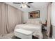 Cozy bedroom with neutral tones, a ceiling fan, and stylish decor at 5016 N 68Th Dr, Glendale, AZ 85303