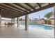 Relaxing covered patio overlooking a refreshing swimming pool in a private backyard oasis at 5561 W Greenbriar Dr, Glendale, AZ 85308