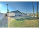 Spacious backyard featuring a in-ground pool, lawn, and enclosed patio at 623 N Parsell --, Mesa, AZ 85203