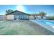 Expansive backyard with in-ground pool, brick accents and enclosed porch at 623 N Parsell --, Mesa, AZ 85203