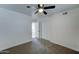 Bedroom features plush carpeting, a ceiling fan, and double door closet at 623 N Parsell --, Mesa, AZ 85203
