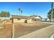 Cozy single-story home with a covered carport and a sparse, drought-resistant landscape at 623 N Parsell --, Mesa, AZ 85203