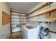 Utility room with washer, dryer and ample shelving at 623 N Parsell --, Mesa, AZ 85203