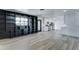 Open-concept living area with custom built-ins seamlessly flowing into a modern kitchen at 623 N Parsell --, Mesa, AZ 85203