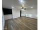 Bright and airy living room boasts hardwood floors, neutral paint, and abundant natural light at 623 N Parsell --, Mesa, AZ 85203