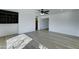 An open living space with modern flooring and built-in shelving for storage, perfect for entertaining and relaxation at 623 N Parsell --, Mesa, AZ 85203