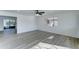 Bright living room with sleek modern flooring, ceiling fan, and sliding doors to enjoy natural light and outdoor views at 623 N Parsell --, Mesa, AZ 85203