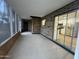 Enclosed sun room featuring brick accents and access to the kitchen through sliding glass doors at 623 N Parsell --, Mesa, AZ 85203