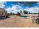 Backyard with desert landscaping, play structure and a private pool providing a perfect outdoor oasis at 6922 S 26Th Ln, Phoenix, AZ 85041