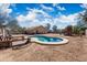 Backyard featuring a private pool, play structure and desert landscaping, great for relaxing and entertaining at 6922 S 26Th Ln, Phoenix, AZ 85041