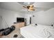 Bright bedroom with a ceiling fan, neutral carpet and a dresser at 6922 S 26Th Ln, Phoenix, AZ 85041