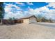 Single-story home featuring desert landscaping, an attached two-car garage and side yard at 6922 S 26Th Ln, Phoenix, AZ 85041