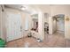 Inviting foyer features a white front door, tiled floor and arched doorways at 6922 S 26Th Ln, Phoenix, AZ 85041