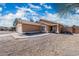 Single-story home with desert landscaping, a two-car garage, and a walkway to the front door at 6922 S 26Th Ln, Phoenix, AZ 85041