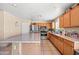 Functional kitchen featuring wood cabinets and stainless steel appliances at 6922 S 26Th Ln, Phoenix, AZ 85041