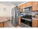 Updated kitchen featuring stainless steel appliances and wood cabinetry at 6922 S 26Th Ln, Phoenix, AZ 85041