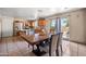 Spacious kitchen and dining area with stainless steel appliances, and backyard access at 6922 S 26Th Ln, Phoenix, AZ 85041