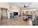 Inviting living room with tile floors, a mounted TV, and cozy seating at 6922 S 26Th Ln, Phoenix, AZ 85041