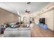 Spacious living room with tile flooring, fan, and stylish furniture for Gathering gatherings at 6922 S 26Th Ln, Phoenix, AZ 85041