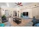 Open living room with neutral colors, tile floor, ceiling fan, and comfortable seating at 6922 S 26Th Ln, Phoenix, AZ 85041