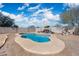 Above shot of the kidney-shaped pool in backyard, surrounded by gravel and a block wall fence at 6922 S 26Th Ln, Phoenix, AZ 85041