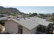 View of a home's roof with mountain views in the background at 7532 N 23Rd St, Phoenix, AZ 85020