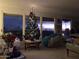 Cozy living room featuring a festive Christmas tree and scenic sunset views at 7532 N 23Rd St, Phoenix, AZ 85020