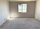 Picture of a bedroom featuring drywall walls and a large window, ready for new home customization at 7691 W Saddlehorn Rd, Peoria, AZ 85383