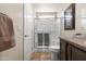 Cozy bathroom features glass-door shower, tile flooring, framed artwork, and white toilet for a clean design at 7807 E Main St # Cc-98, Mesa, AZ 85207