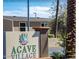 Welcoming community sign with desert landscaping and palm trees showing the entrance to Agave Village at 7807 E Main St # Cc-98, Mesa, AZ 85207