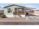 Charming home with covered porch and carport for relaxed outdoor living and convenient parking at 7807 E Main St # Cc-98, Mesa, AZ 85207