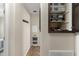 Neutral hallway with storage cabinets and a step stool, offering a clean and organized space at 7807 E Main St # Cc-98, Mesa, AZ 85207