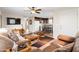 Open-concept living area with view into the kitchen, featuring comfortable furnishings and natural light at 7807 E Main St # Cc-98, Mesa, AZ 85207