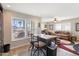 Bright living room with a view from large windows and an island with barstool seating at 7807 E Main St # Cc-98, Mesa, AZ 85207