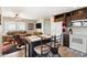 Inviting living room and kitchen area with a ceiling fan and comfortable seating at 7807 E Main St # Cc-98, Mesa, AZ 85207