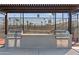 Community outdoor cooking area with built-in stainless steel grills and prep station for convenient and enjoyable grilling at 7807 E Main St # Cc-98, Mesa, AZ 85207