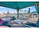 Relaxing poolside lounge area with comfortable seating, umbrellas, and views of the community pool at 7807 E Main St # Cc-98, Mesa, AZ 85207