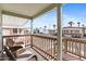 Inviting porch with wicker chairs, wood railing, and view of the community, creating a relaxing outdoor retreat at 7807 E Main St # Cc-98, Mesa, AZ 85207
