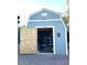 Exterior of a painted storage shed with an open door reveals ample storage space in a well-maintained backyard at 7807 E Main St # Cc-98, Mesa, AZ 85207