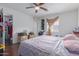 Cozy bedroom featuring a ceiling fan and natural lighting at 8339 W Devonshire Ave, Phoenix, AZ 85037