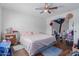 Bedroom with ceiling fan, hardwood flooring, and ensuite at 8339 W Devonshire Ave, Phoenix, AZ 85037