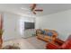 Inviting living room featuring tile floors, a large TV, and comfortable seating at 8339 W Devonshire Ave, Phoenix, AZ 85037