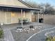 Backyard showcasing a covered patio, rock garden, and BBQ area at 9644 N 97Th Ln, Peoria, AZ 85345