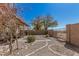 Low maintenance backyard featuring gravel landscaping, stone pavers, and a desert-friendly design at 9644 N 97Th Ln, Peoria, AZ 85345
