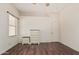 Bedroom showcasing wood flooring, bright natural light, and neutral-colored walls at 9644 N 97Th Ln, Peoria, AZ 85345