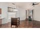 Cozy dining area with a ceiling fan, flowing seamlessly into the living space at 9644 N 97Th Ln, Peoria, AZ 85345