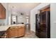 Modern kitchen with stainless steel appliances and an open view to the living area at 9644 N 97Th Ln, Peoria, AZ 85345