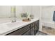 Elegant bathroom featuring a double sink vanity, white countertops, and sleek fixtures and fittings at 10148 W Avenida Del Rey --, Peoria, AZ 85383